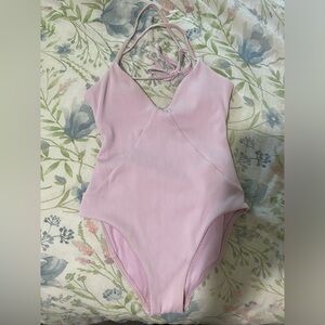 Light pink one piece bathing suit
